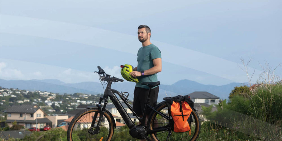 Jason Cluley stands by his bike enjoying an elevated view