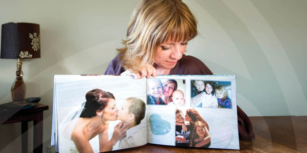 Chelsea Norman looks at a photo album