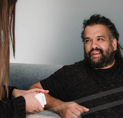 Two people talking to one another.