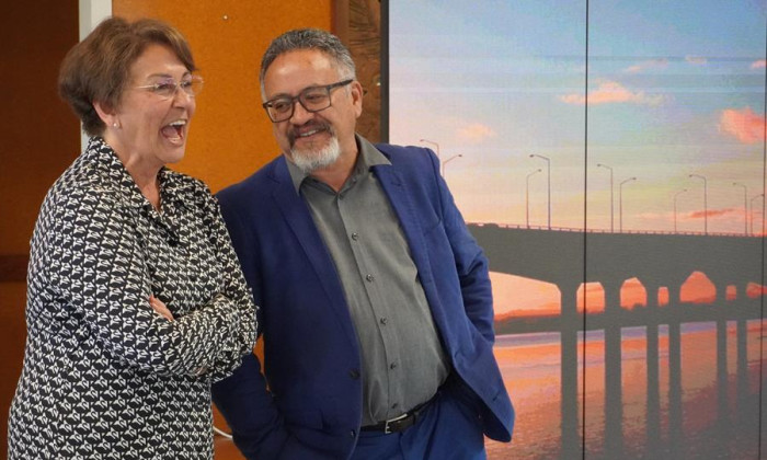 Commissioner Hekia Parata on left, laughs with MUMA chair Bernie O'Donnell on the right.